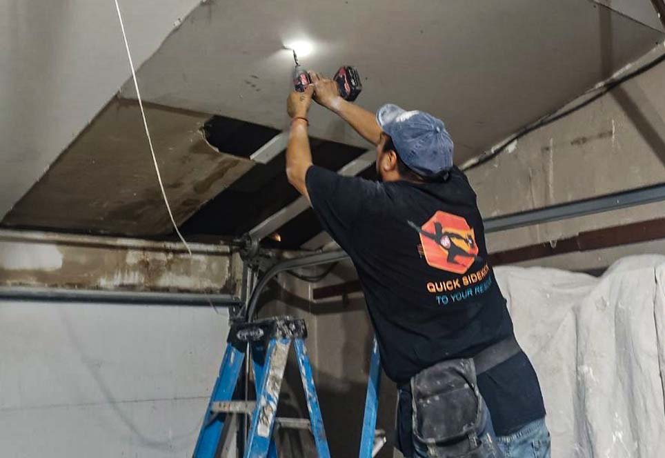 Drywall repair in progress by contractors in a Vancouver BC home