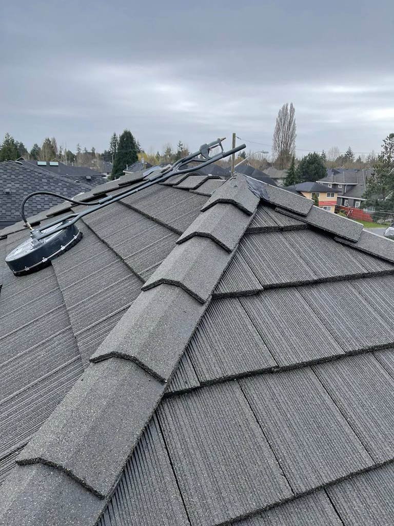 Roof cleaning after power washing flat tile roof