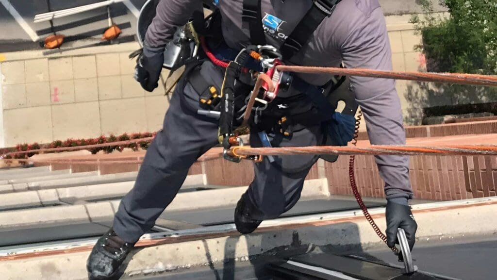 high rise window cleaning handyman hanging