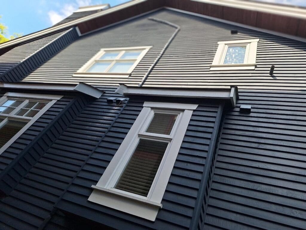 Dirty windows on the main floor of a house in North Vancouver before exterior window cleaning