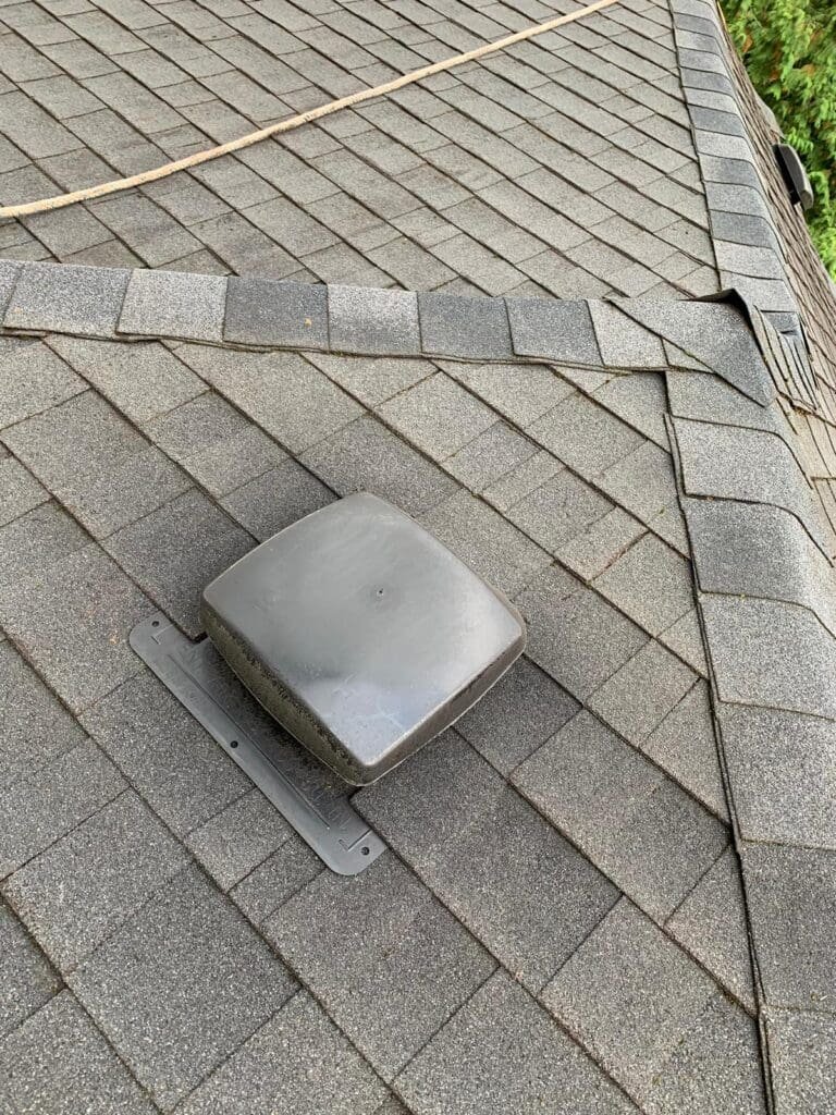 Roof after professional cleaning showing moss-free, restored shingles on a Vancouver home