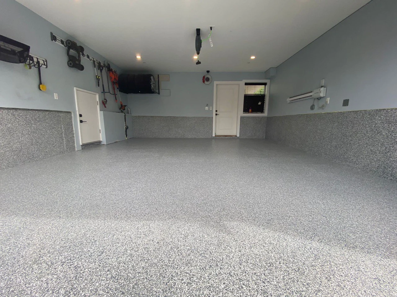 After epoxy flooring installation in Burnaby showing glossy smooth garage floor coating