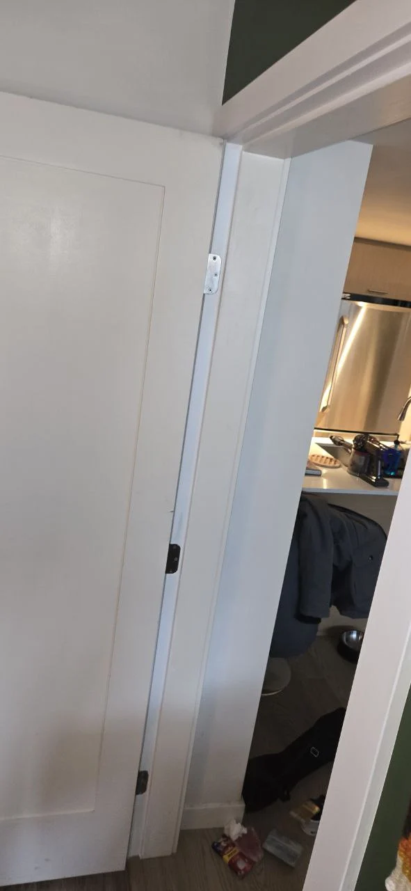After door frame repair in Burnaby showing fully restored and reinforced door frame with clean professional finish