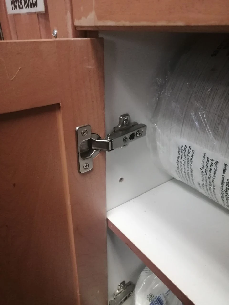 After door hinge repair in Burnaby showing fully restored door hinge with smooth door operation and proper secure fit