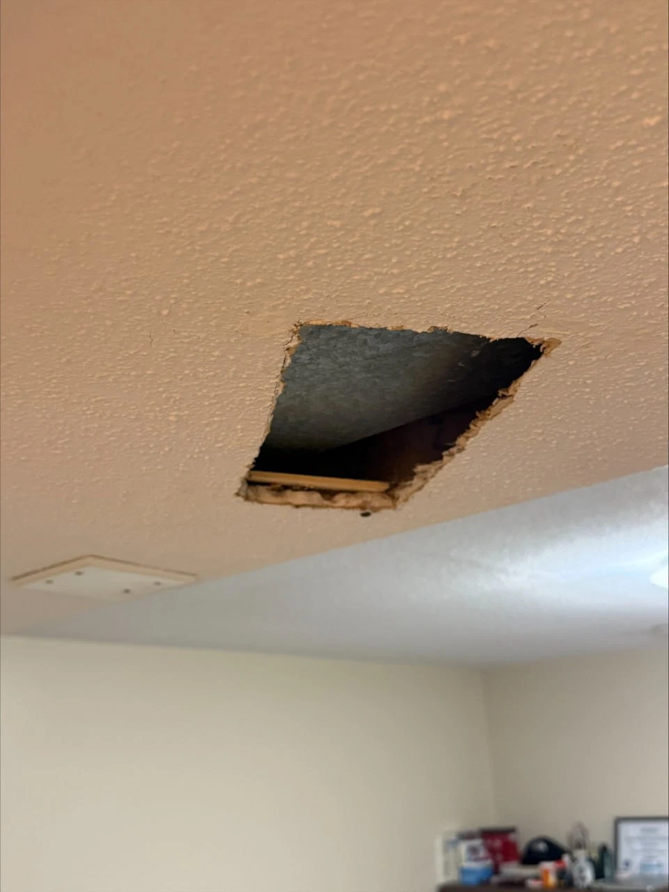 Before drywall popcorn ceiling repair in Burnaby showing old damaged popcorn texture ceiling with visible cracks and discoloration requiring expert repair