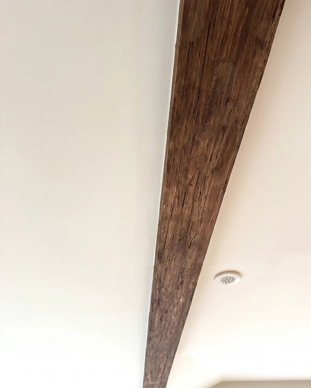 After drywall repair in Burnaby showing gap between wall panels fully patched and seamlessly finished