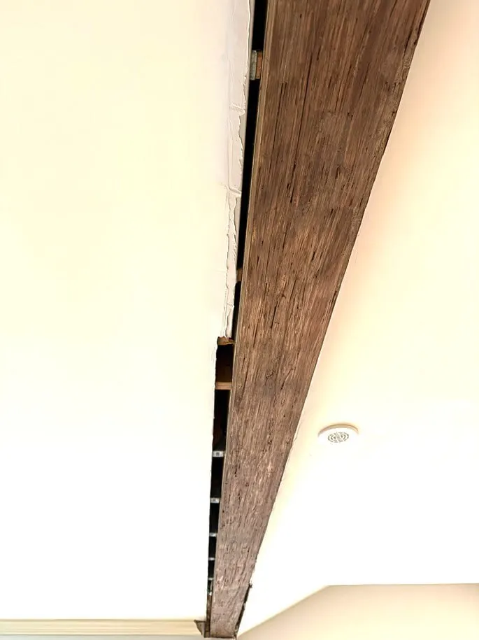 Before drywall repair in Burnaby showing visible gap and separation between drywall panels