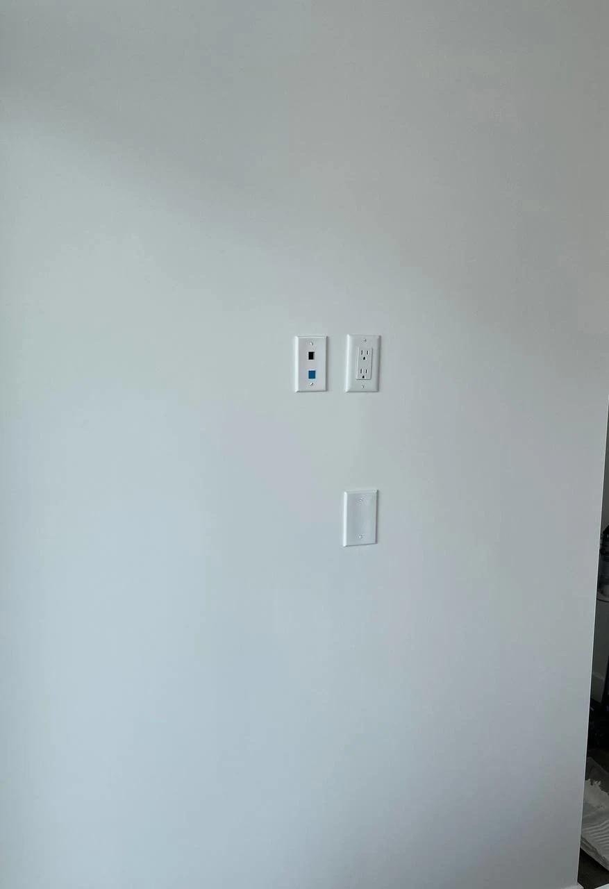 Before drywall repair in Burnaby showing large rip and torn drywall damage on interior wall
