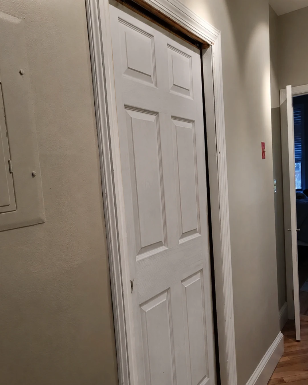 Before pocket door replacement in Burnaby showing damaged misaligned pocket door requiring full replacement service