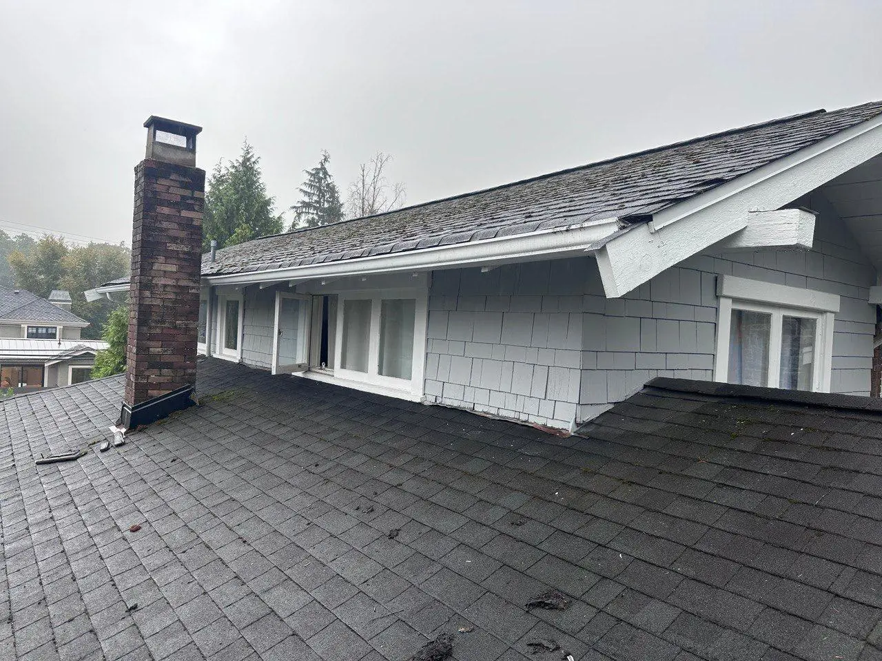 New white seamless gutter installed along roofline after replacement in Vancouver BC