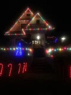Christmas lights installed on rooflines peaks and entrance of a Vancouver home
