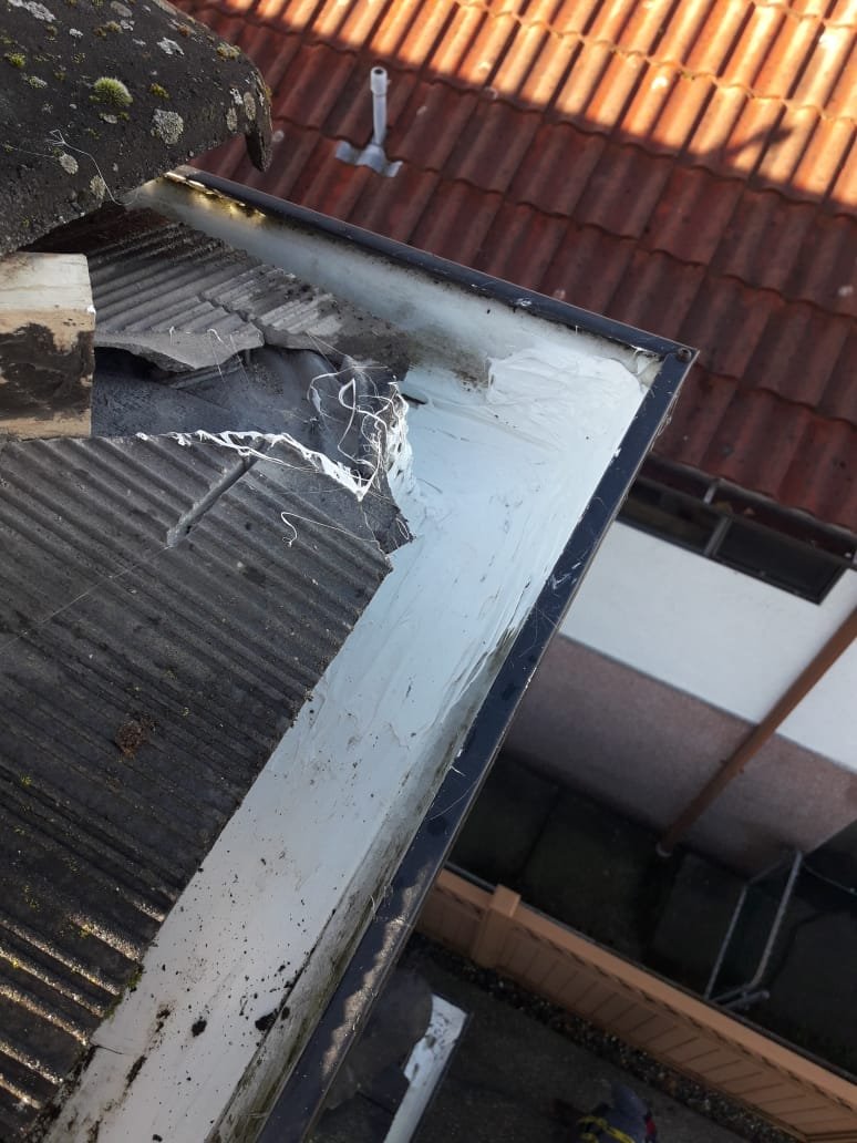 Applying gutter sealant to repair a leaking gutter in Vancouver