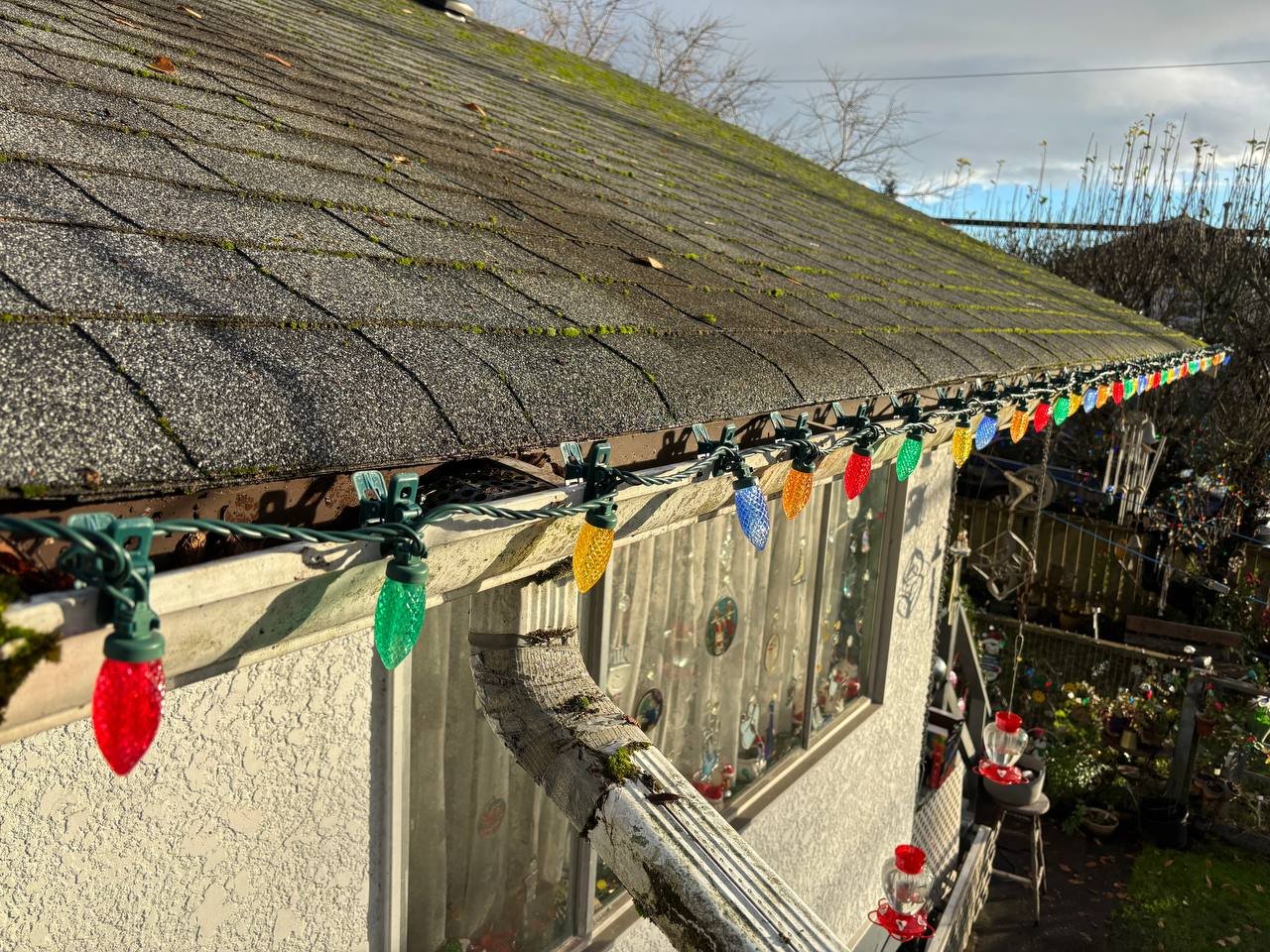 Christmas lights installed along a roofline in Vancouver