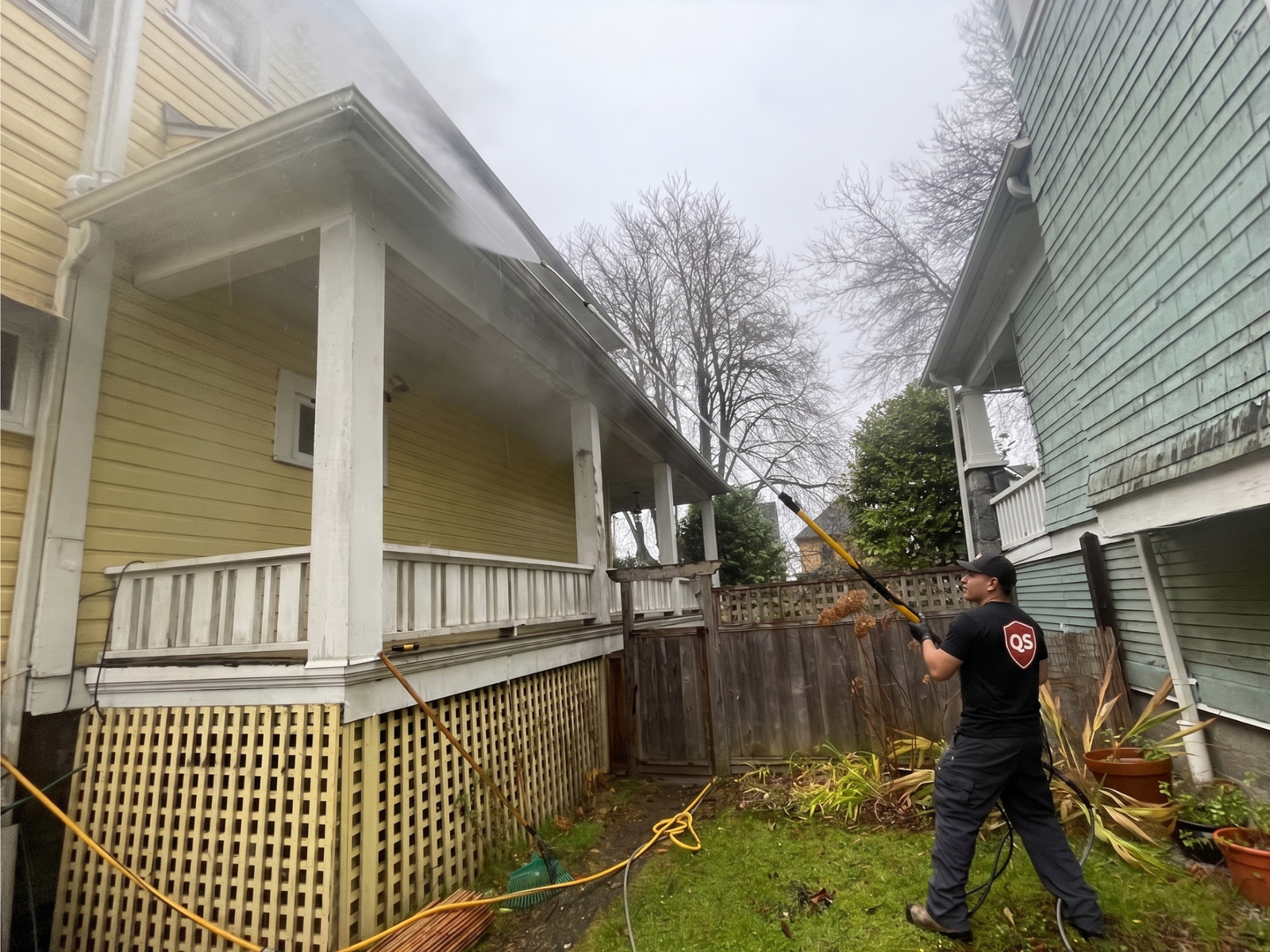 Exterior gutter cleaning using a water-fed brush