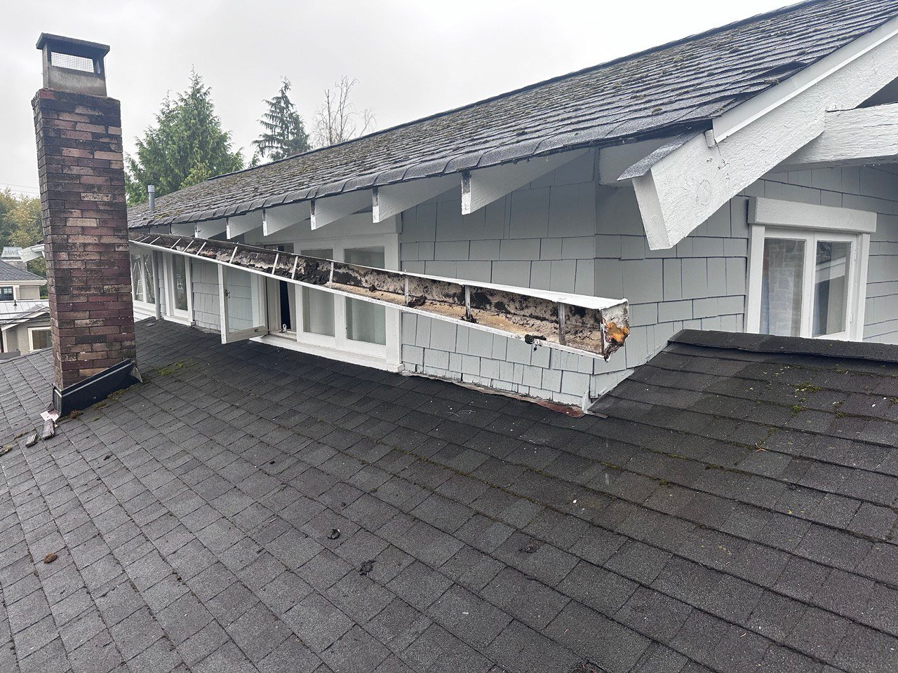 Loose gutter pulling away from the fascia of a house in Vancouver