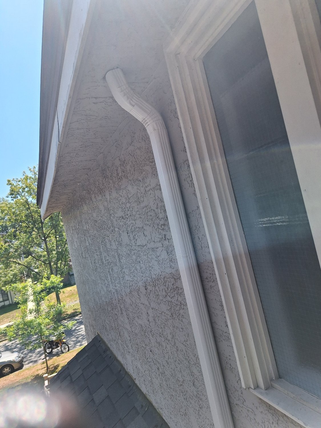 New downpipe installed for a built-in gutter system in Vancouver