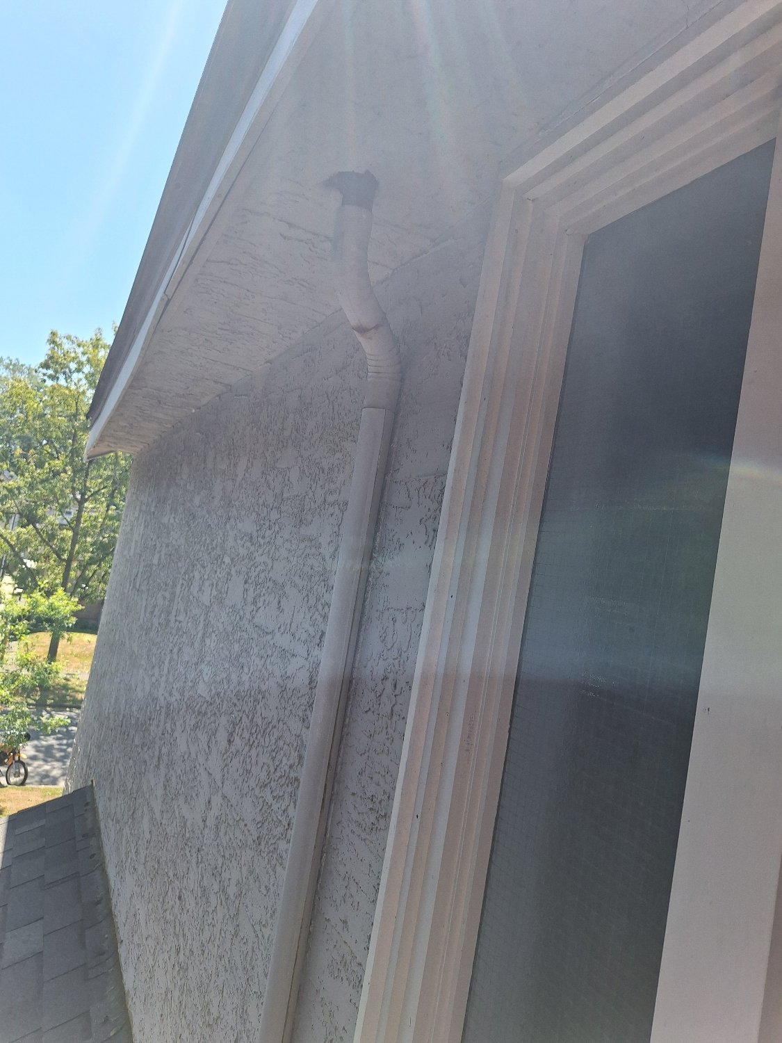 Old built-in gutter downpipe before replacement in Vancouver