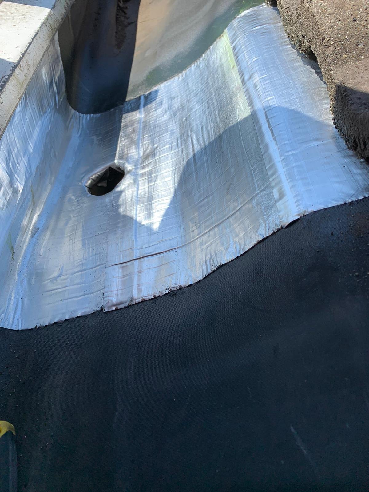 Built-in gutter seam after waterproof patch repair in Vancouver