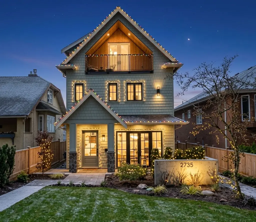Christmas light installation on a tall residential home in Vancouver