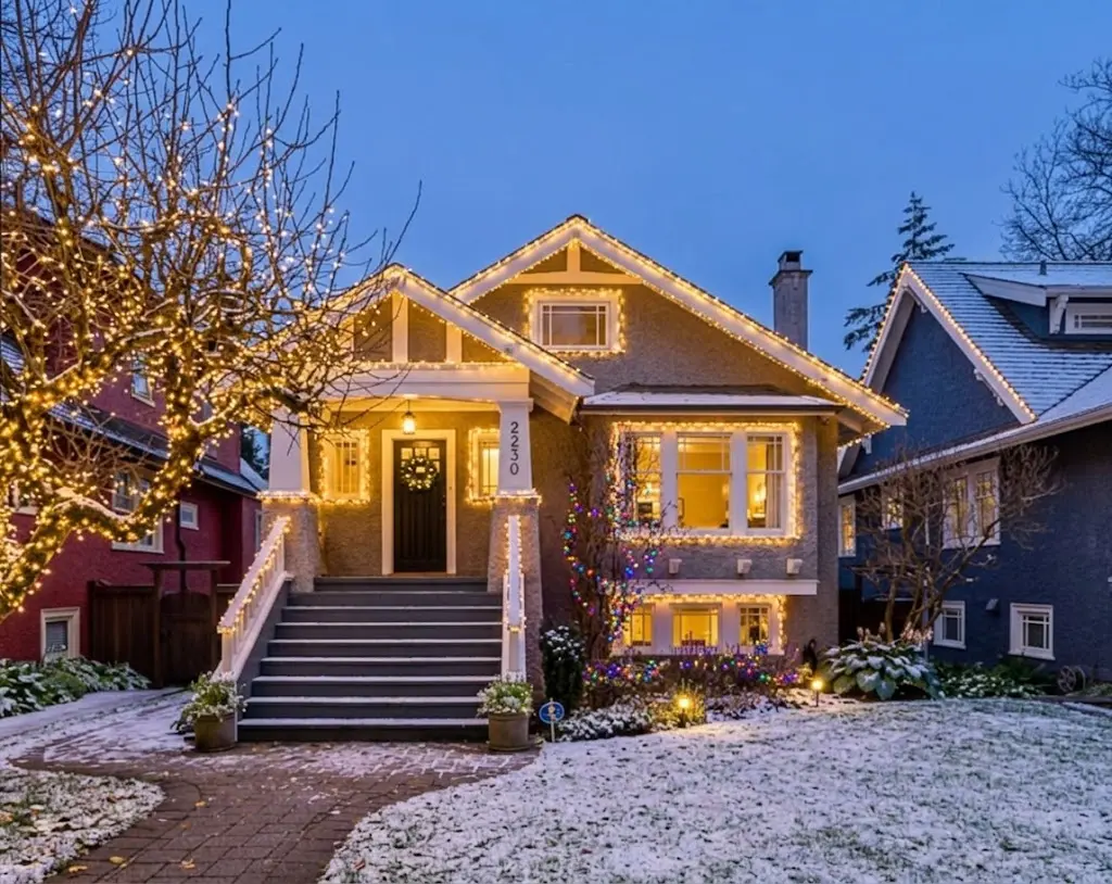 Christmas lights installed on a two-level Vancouver house