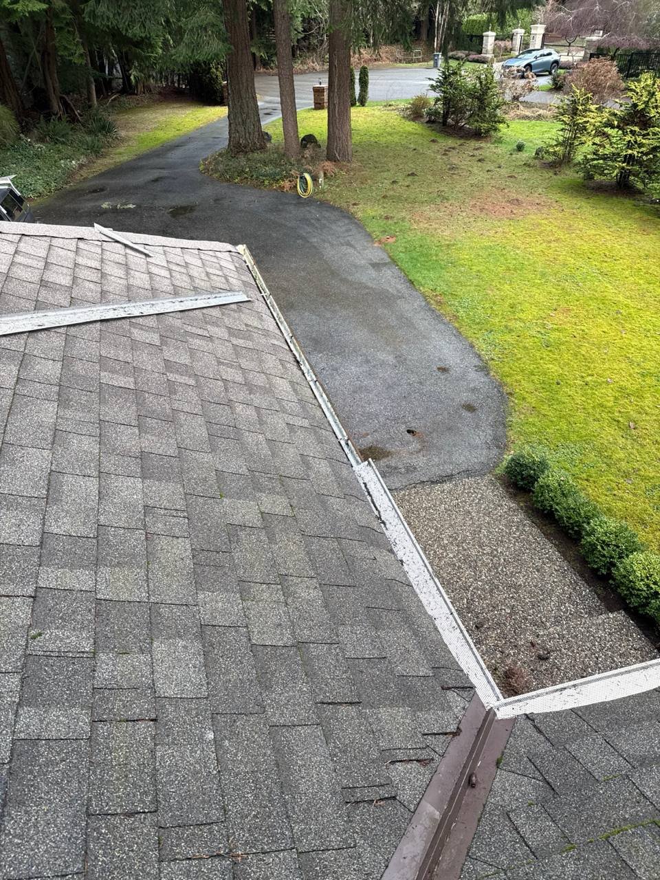 Removing gutter guards before cleaning the gutter