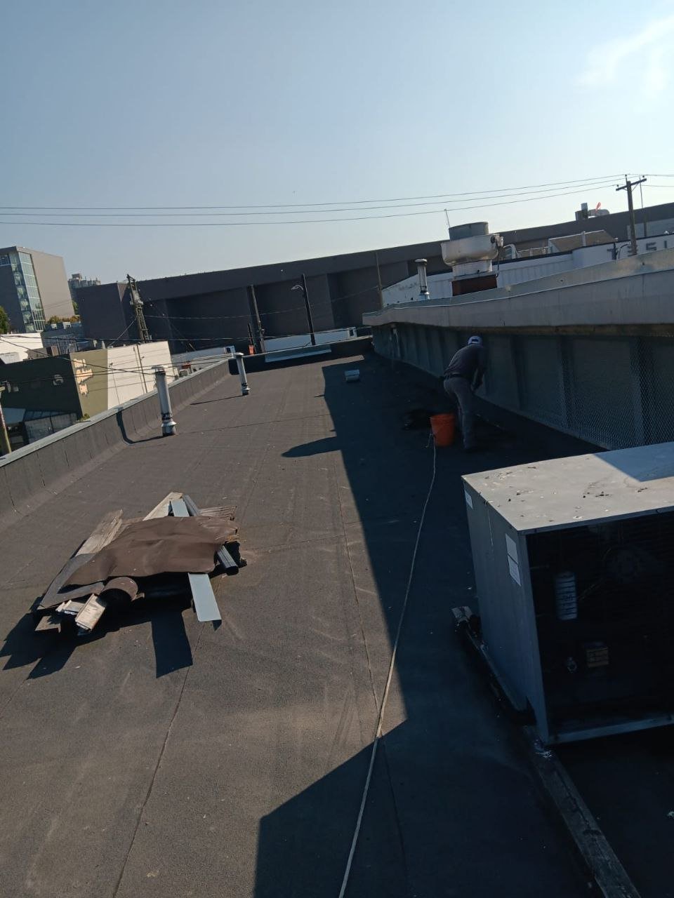 Commercial flat roof cleaning and roof drain clearing in Vancouver