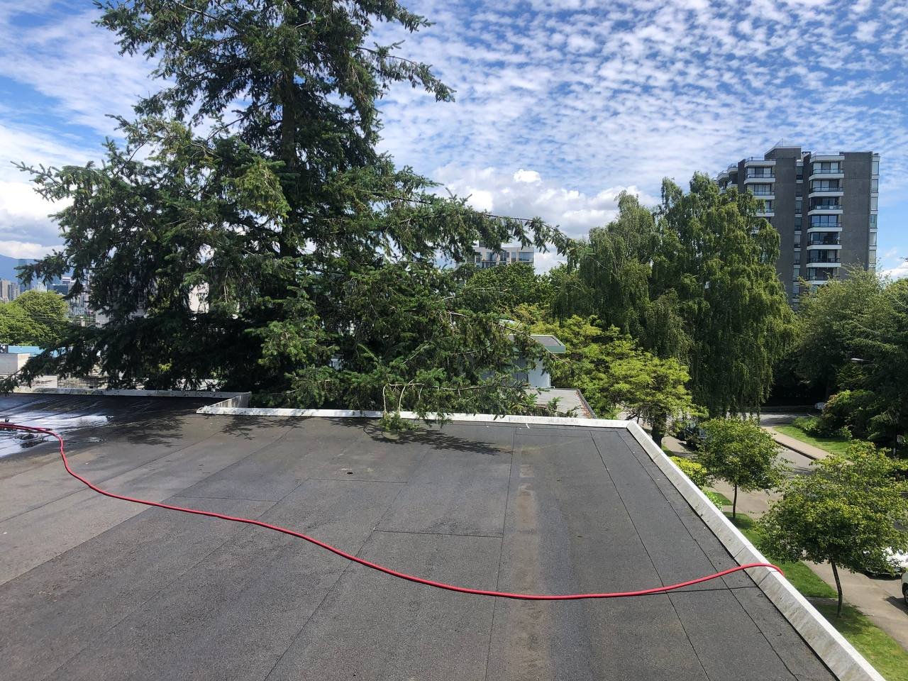Flat roof drain after cleaning with debris removed