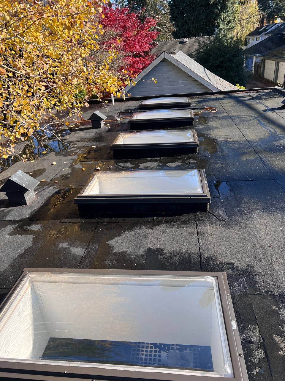 Flat roof scupper after debris removal and cleaning