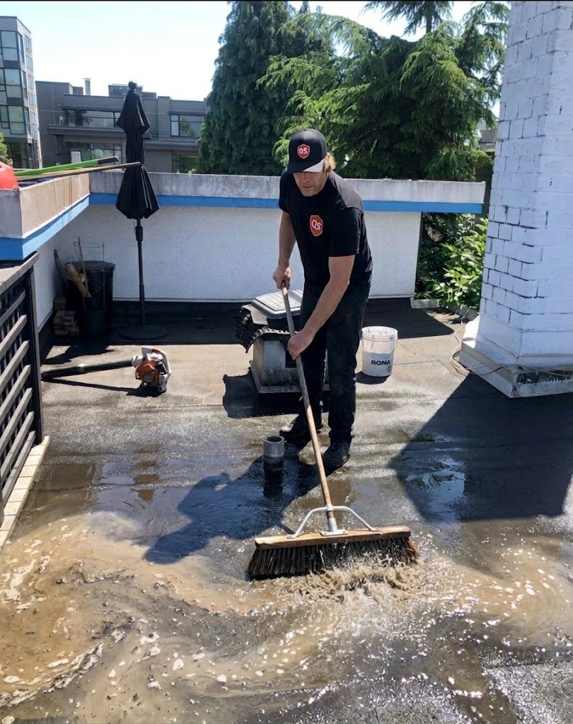 Flat roof membrane being scrubbed during cleaning