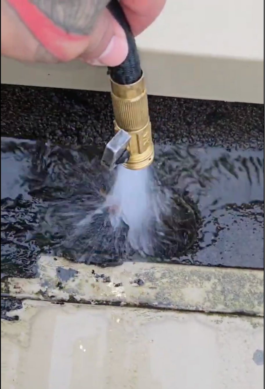 Checking water flow through a commercial gutter and downpipe