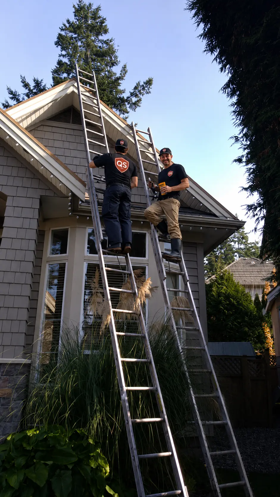 Installing Christmas lights on a residential house in Vancouver
