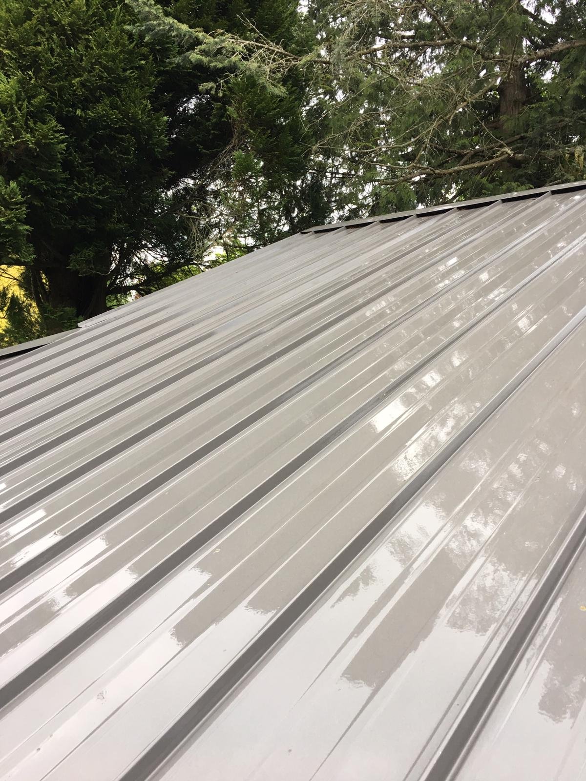 Metal roof with dirt and organic buildup before professional cleaning in Vancouver