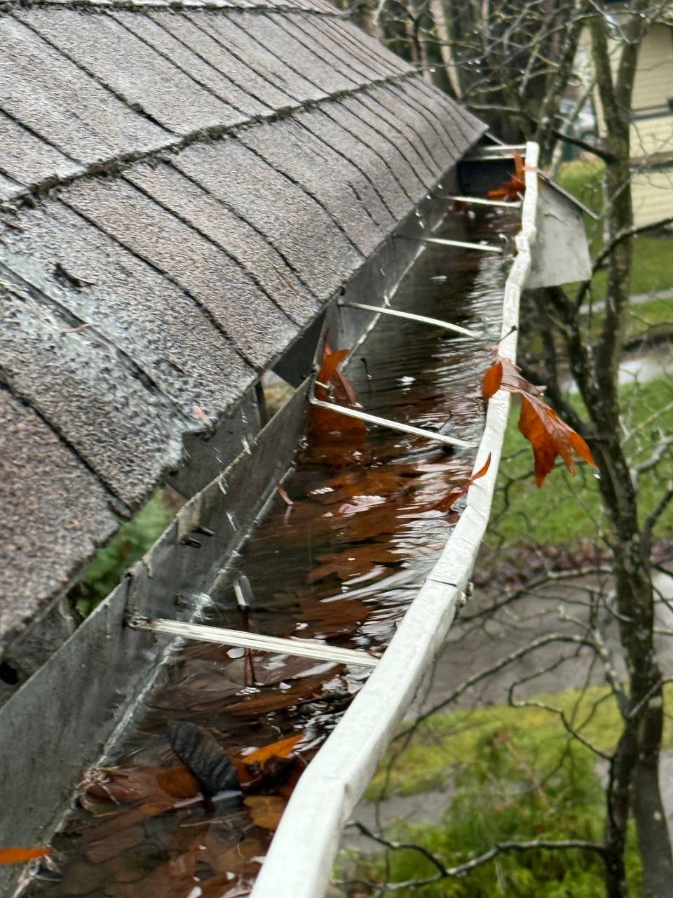Sagging gutter holding water and overflowing in Vancouver