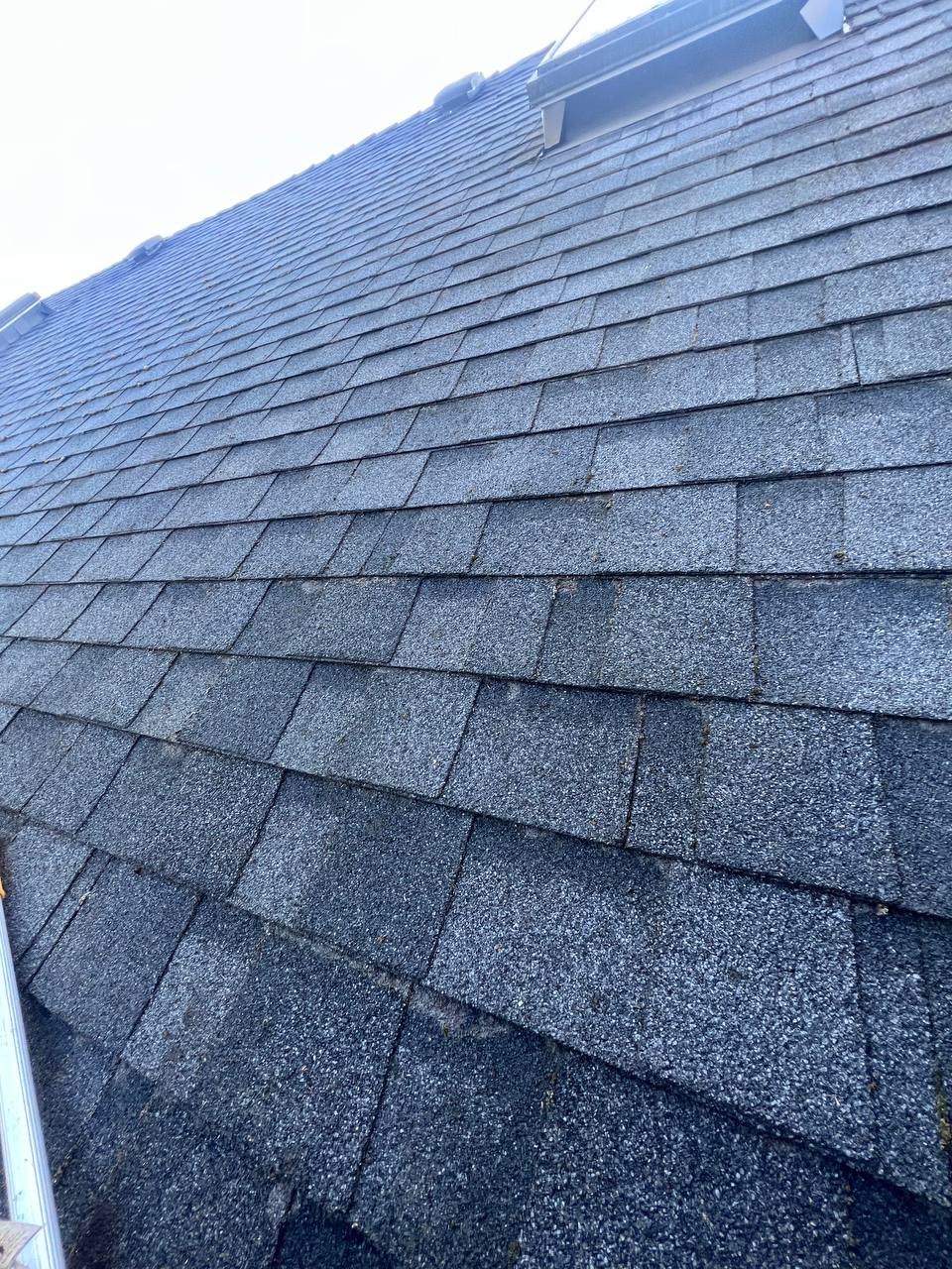 After debris removal from asphalt shingle roof in Vancouver
