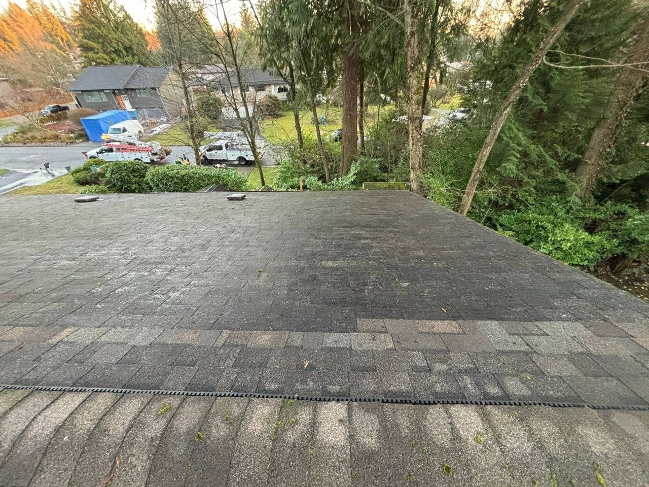 Roof valley after debris removal and roof blowing service