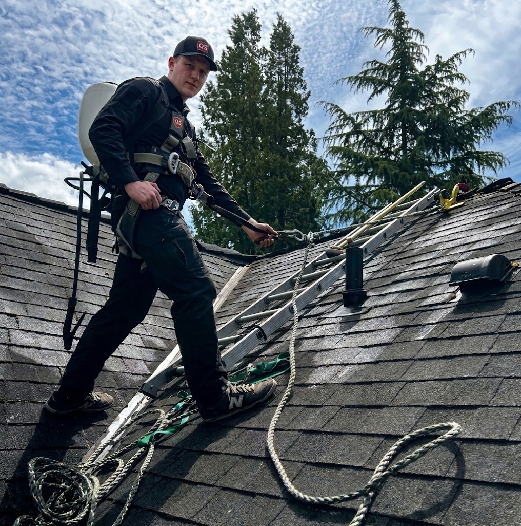 Quick Sidekick technician cleaning an asphalt shingle roof in Vancouver