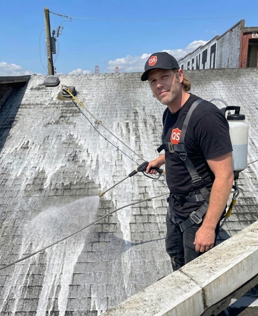 Quick Sidekick technician applying spray-on roof moss treatment in Vancouver