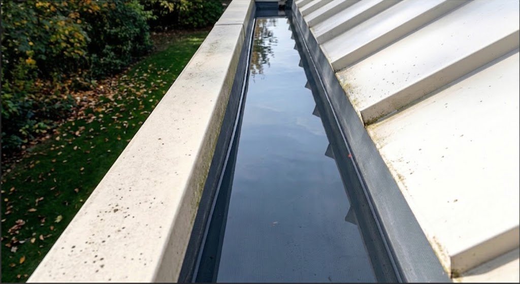 Standing water inside a built-in gutter