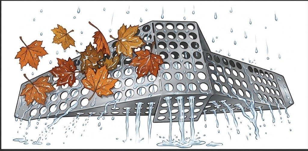 Rainwater flowing through the openings of a gutter basket into a downspout