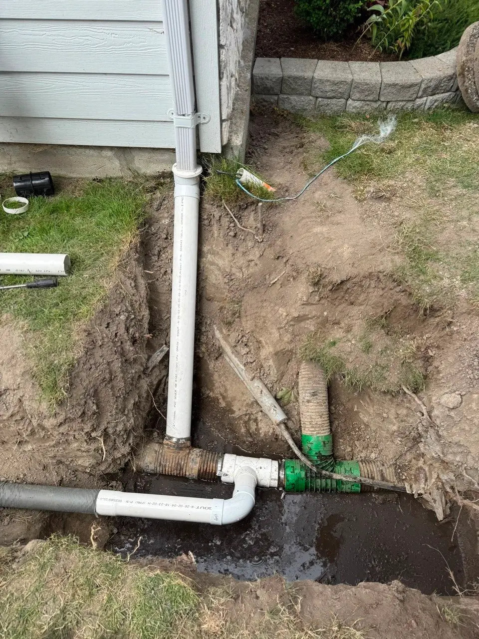 Old and new underground drain tile connected together