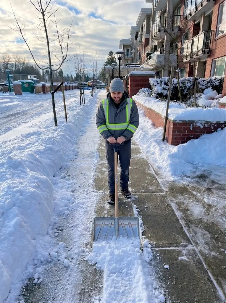 Quick Sidekick crew member clearing snow from a Vancouver sidewalk