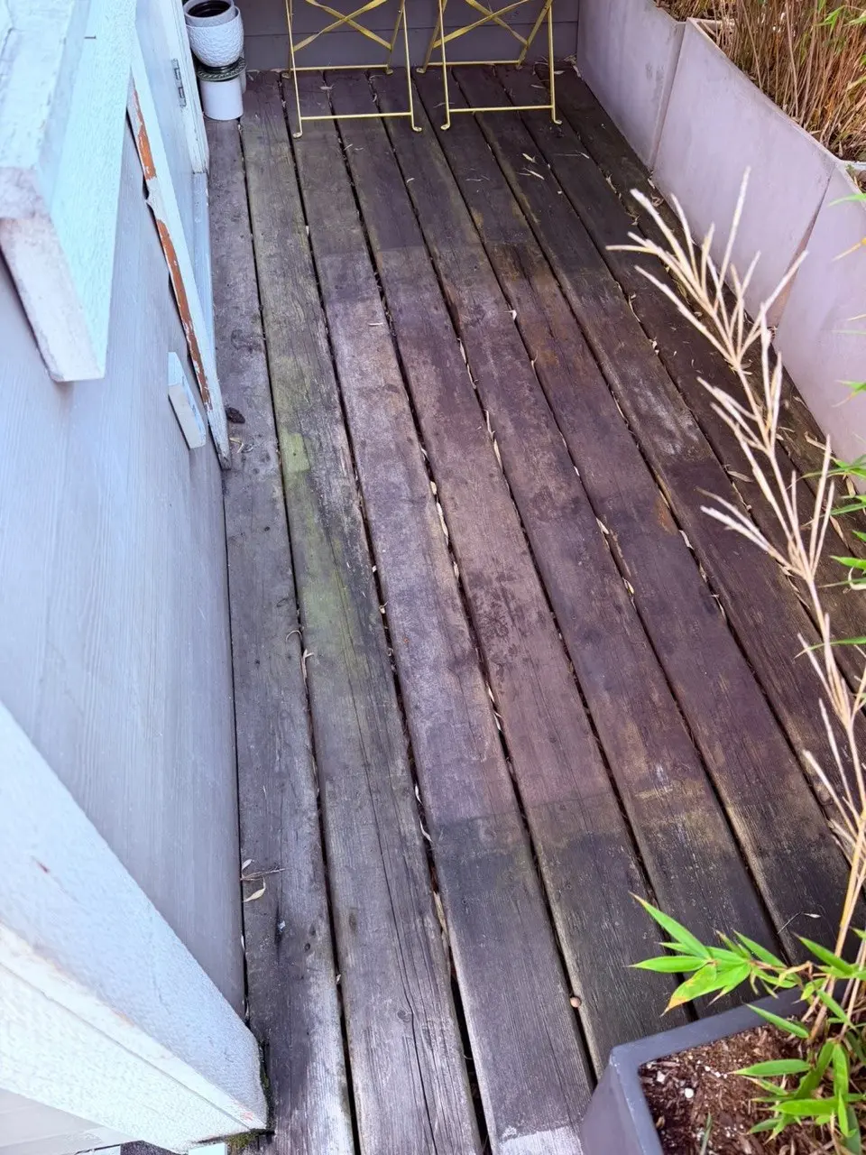 Dull and weathered wooden deck before cleaning
