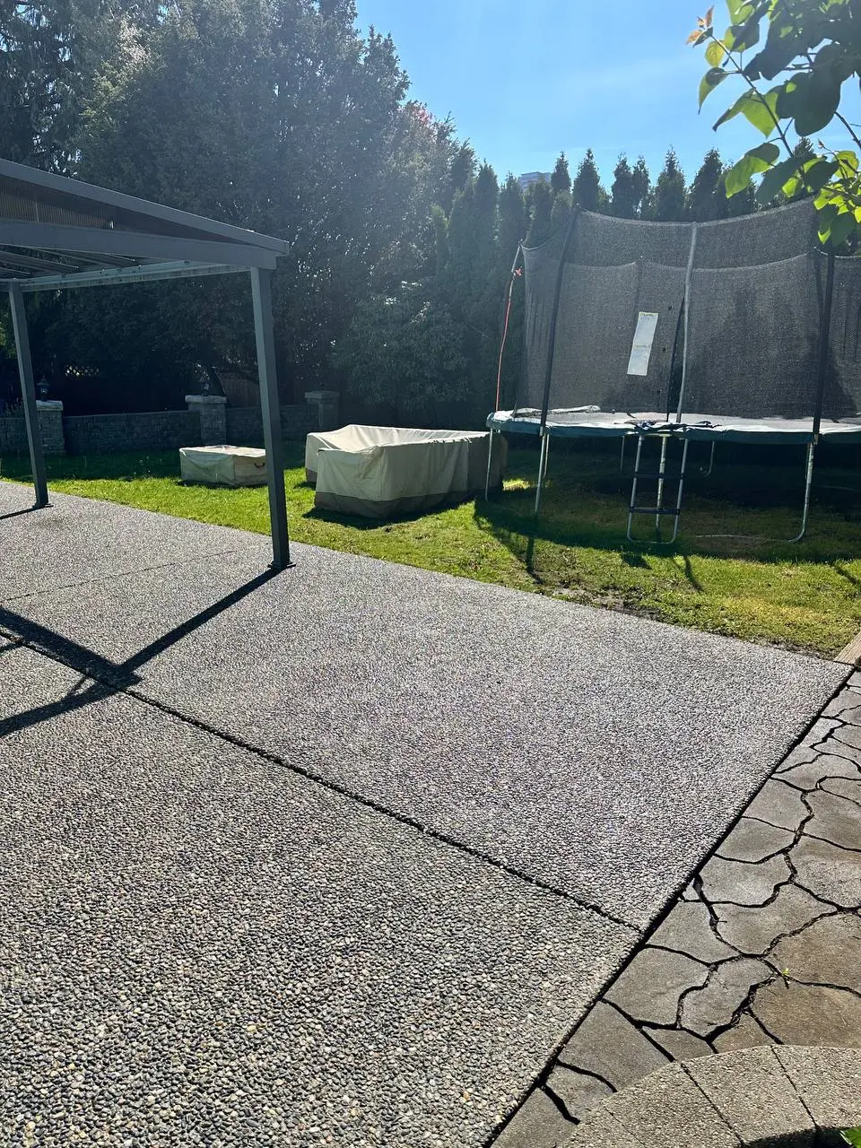 Close-up of exposed aggregate concrete with decorative stones