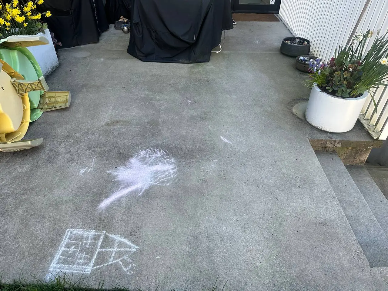 Concrete patio before professional pressure washing