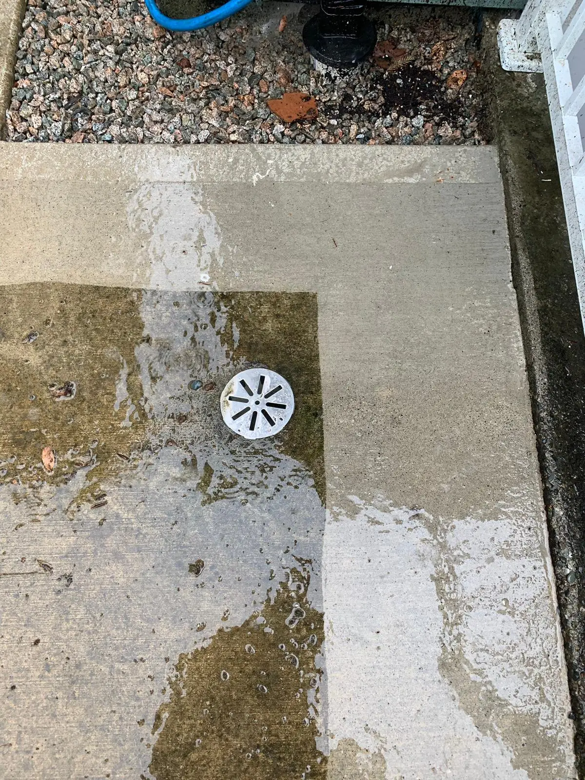 Professional concrete pressure washing using a flat surface cleaner in Vancouver