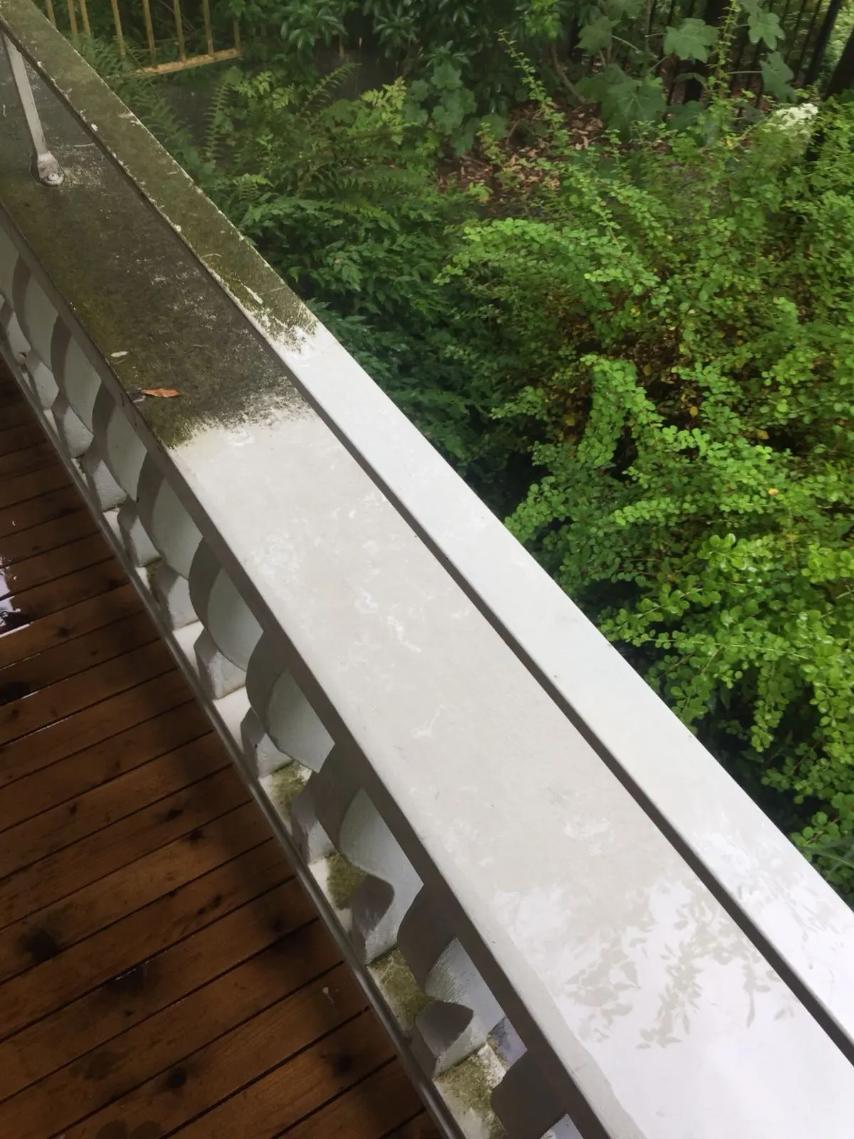 Mud and dirt buildup on outdoor deck railings